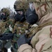 Explosives Ordinance Disposal Airmen conduct live-fire range in simulated chemical environment