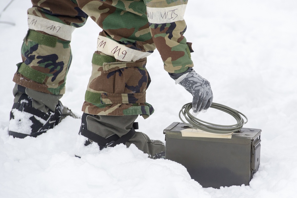 Explosives Ordinance Disposal Airmen conduct live-fire range in simulated chemical environment