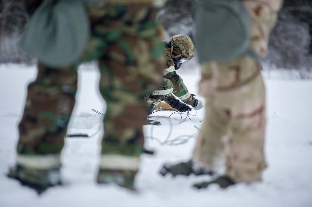 Explosives Ordinance Disposal Airmen conduct live-fire range in simulated chemical environment