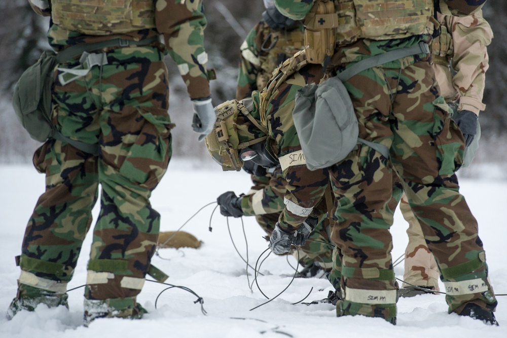 Explosives Ordinance Disposal Airmen conduct live-fire range in simulated chemical environment