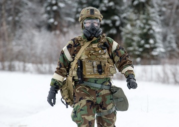 Explosives Ordinance Disposal Airmen conduct live-fire range in simulated chemical environment