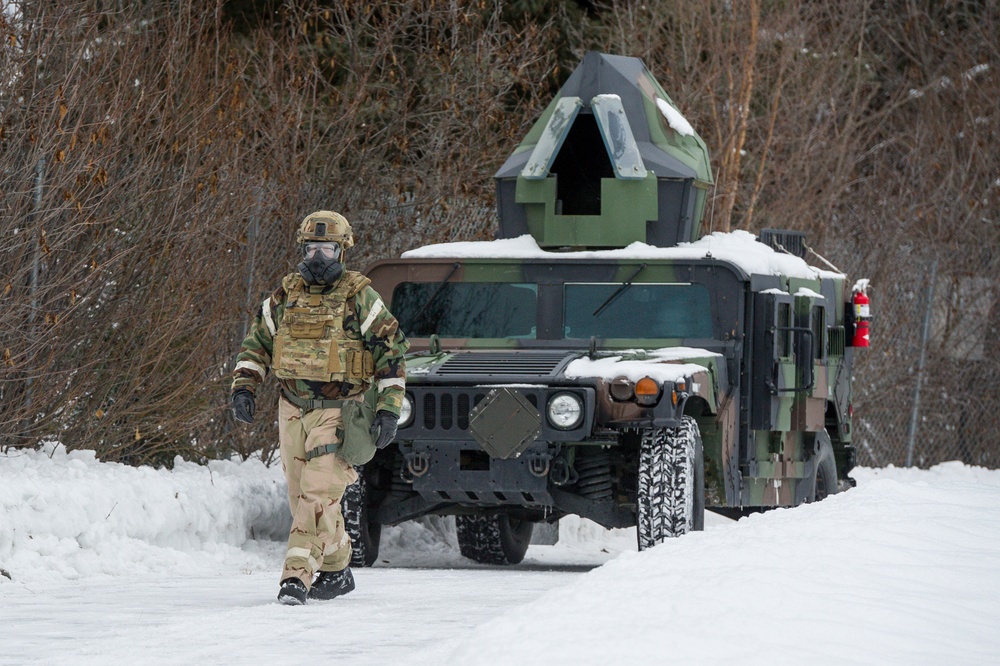 Explosives Ordinance Disposal Airmen conduct live-fire range in simulated chemical environment