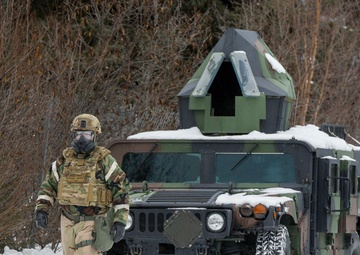 Explosives Ordinance Disposal Airmen conduct live-fire range in simulated chemical environment