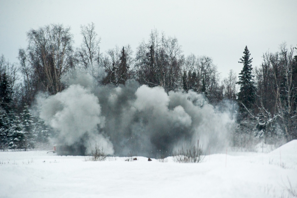 Explosives Ordinance Disposal Airmen conduct live-fire range in simulated chemical environment