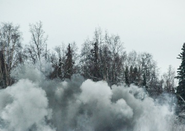 Explosives Ordinance Disposal Airmen conduct live-fire range in simulated chemical environment