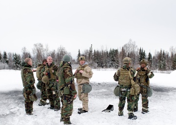 Explosives Ordinance Disposal Airmen conduct live-fire range in simulated chemical environment