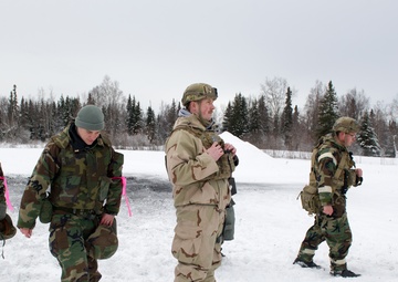 Explosives Ordinance Disposal Airmen conduct live-fire range in simulated chemical environment
