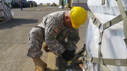 Unloading pallets to help disaster relief in Pacific