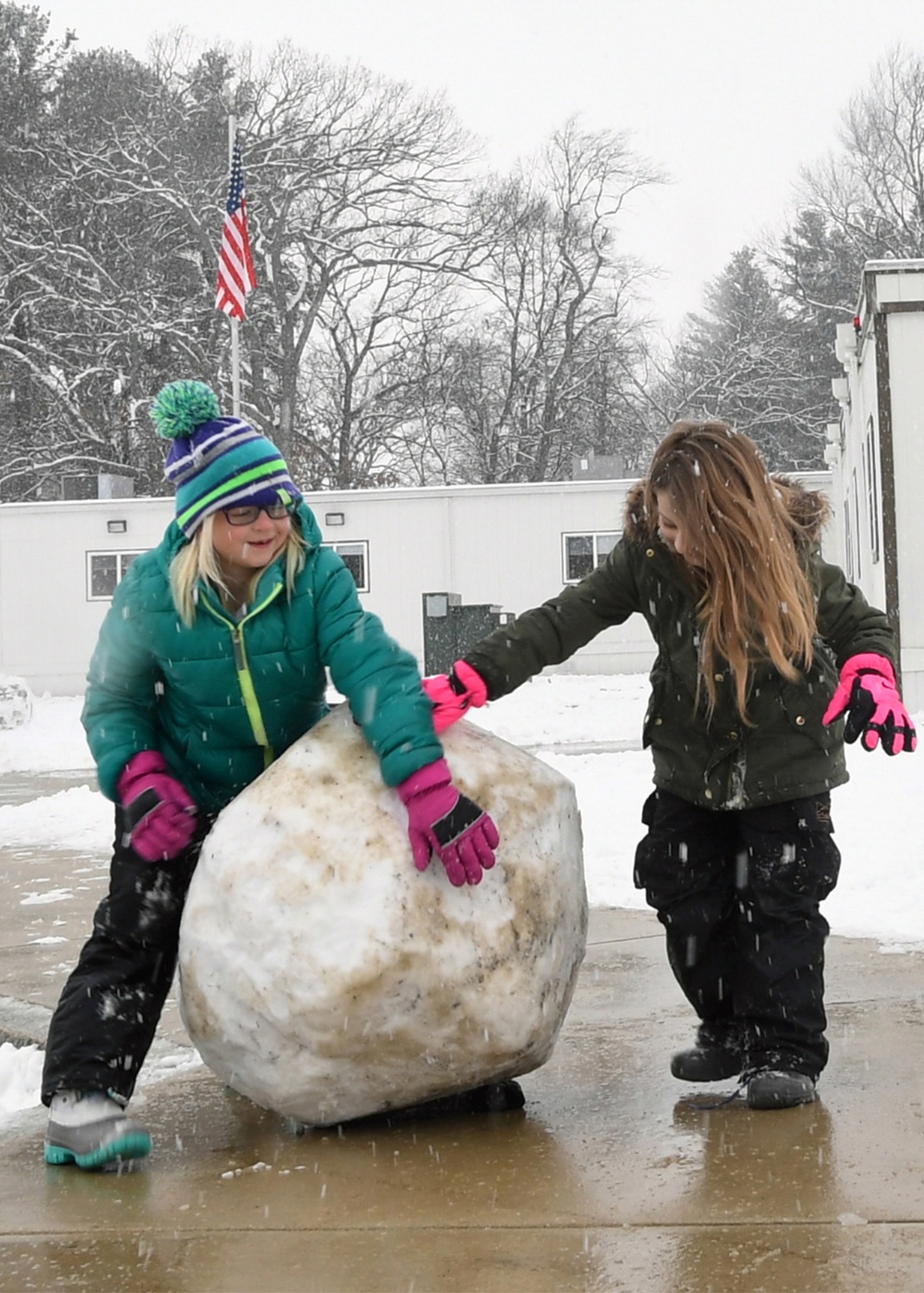 Snow falls on base