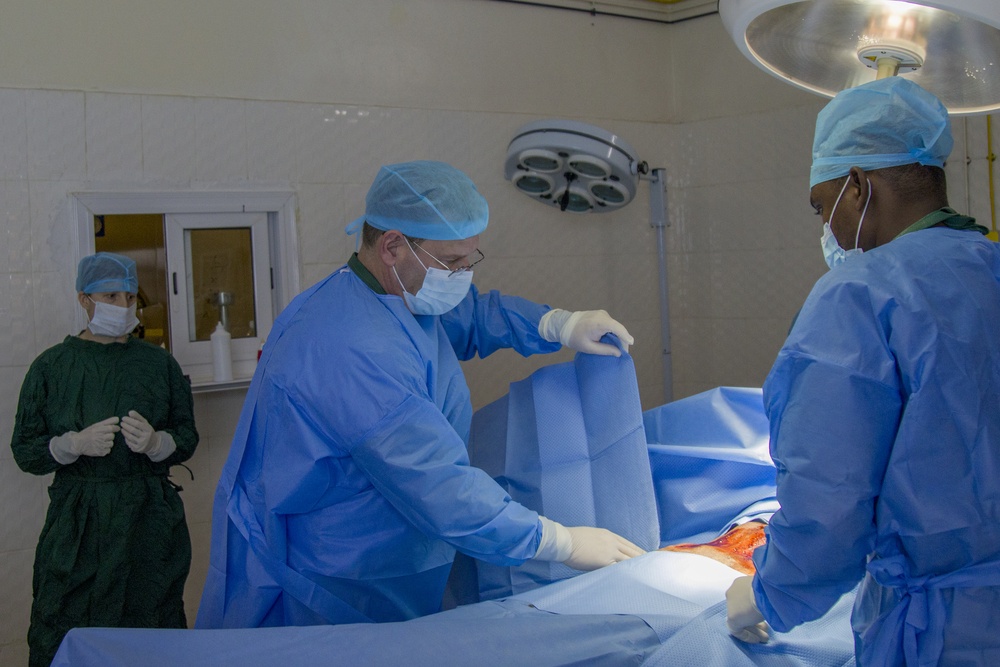 Vermont National Guard Surgeon Places Sterile Drape on Patient