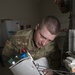Soldier Checks Connections on an Equipment Sterilization Unit