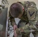 Soldier Checks Connections on an Equipment Sterilization Unit