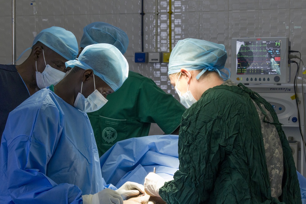 Soldier Assists in Surgery