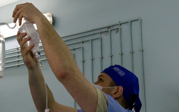 Soldier Prepares Saline Drip
