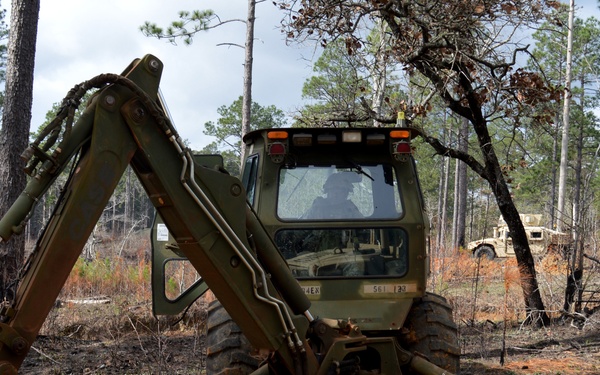 Engineers dig troop trenches for defense at JRTC
