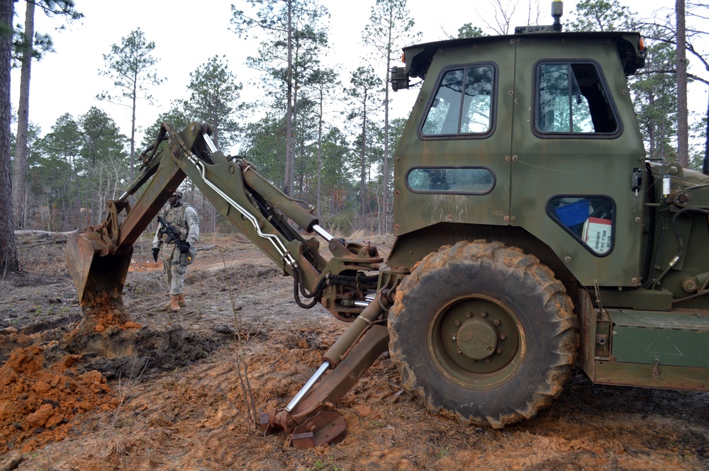 Engineers dig troop trenches for defense at JRTC