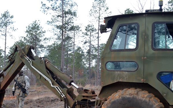Engineers dig troop trenches for defense at JRTC