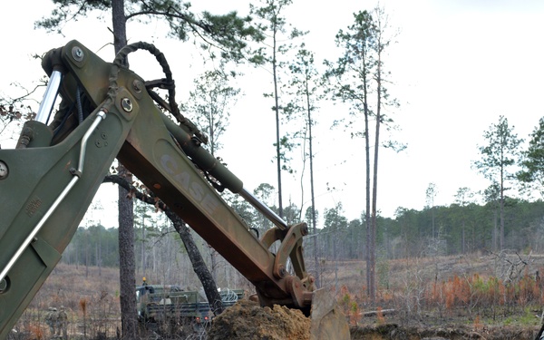 Engineers dig troop trenches for defense at JRTC
