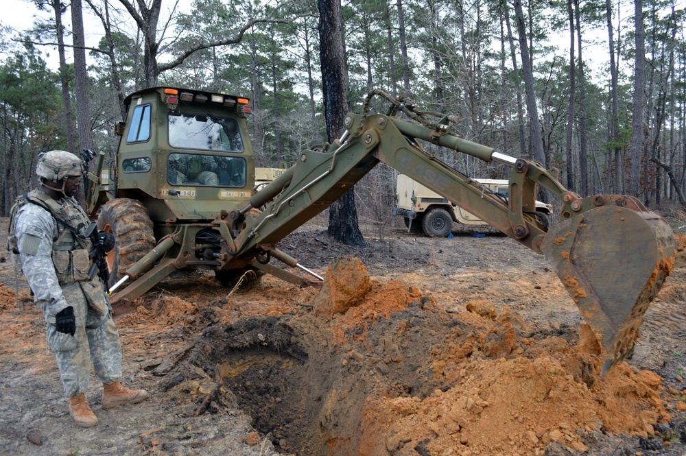 Engineers dig troop trenches for defense at JRTC