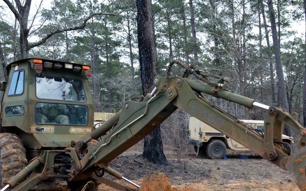 Engineers dig troop trenches for defense at JRTC