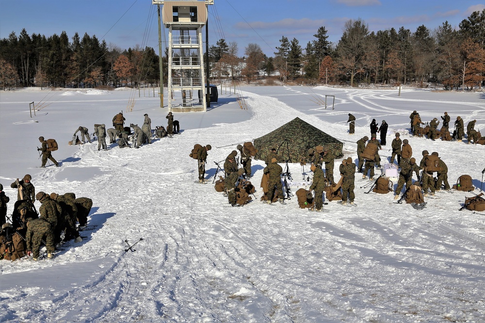 Cold-Weather Operations Course Class 18-04 students build Arctic tents during training at Fort McCoy