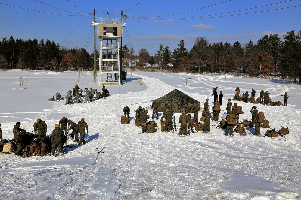 Cold-Weather Operations Course Class 18-04 students build Arctic tents during training at Fort McCoy