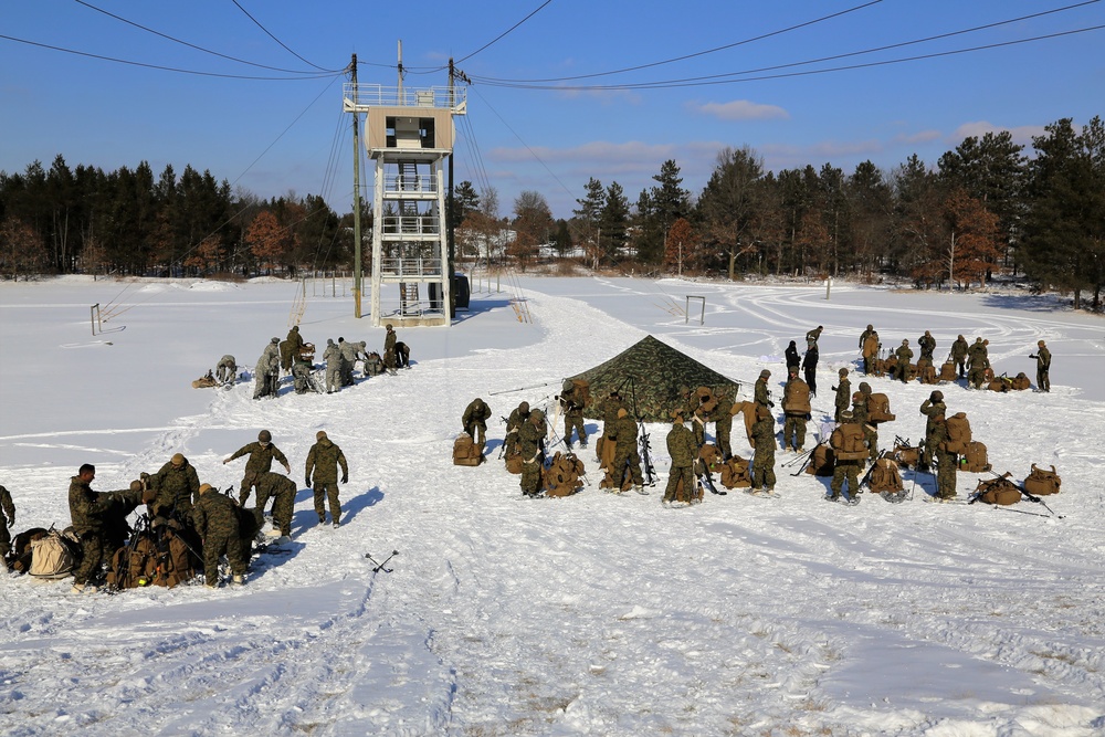 Cold-Weather Operations Course Class 18-04 students build Arctic tents during training at Fort McCoy