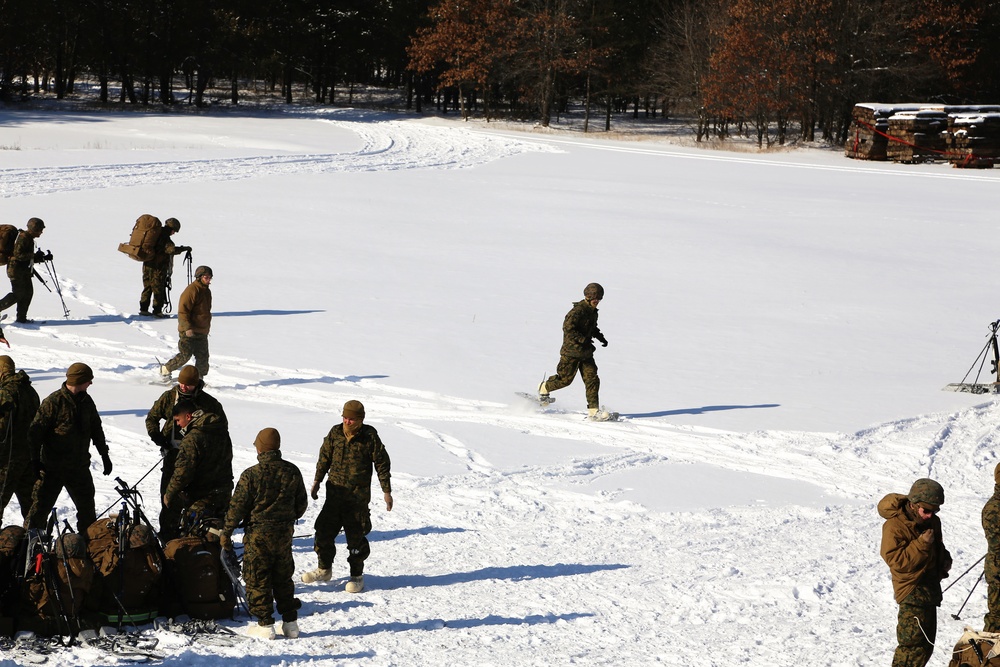 Cold-Weather Operations Course Class 18-04 students build Arctic tents during training at Fort McCoy