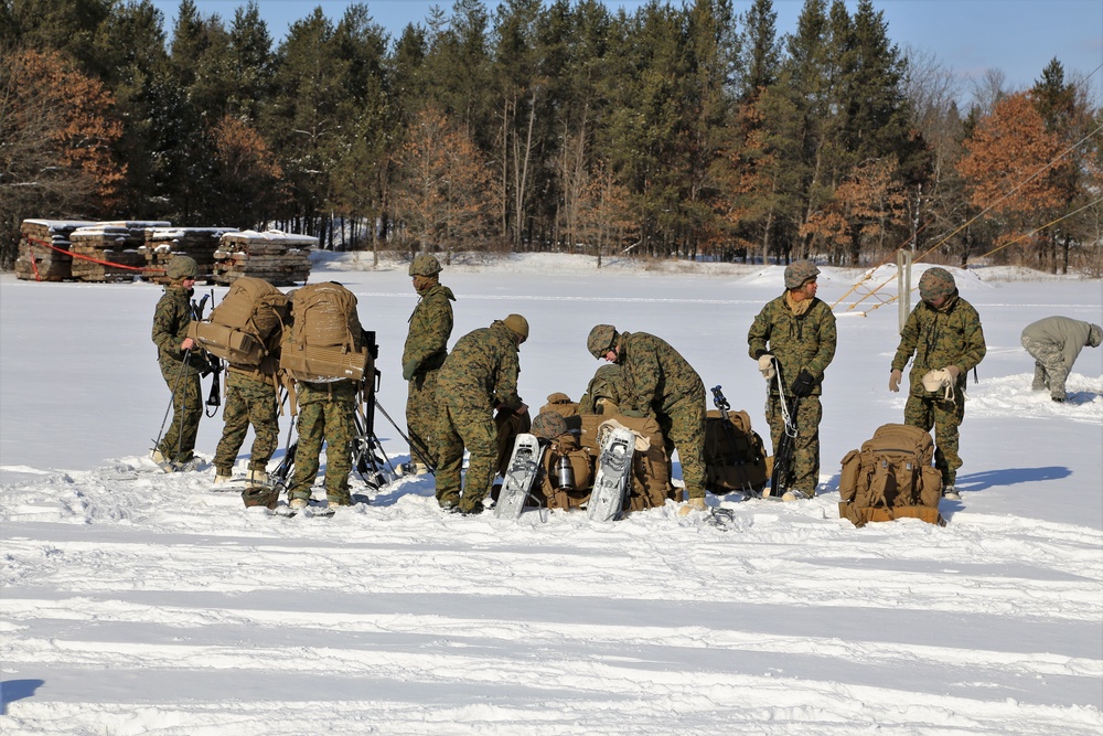 Cold-Weather Operations Course Class 18-04 students build Arctic tents during training at Fort McCoy