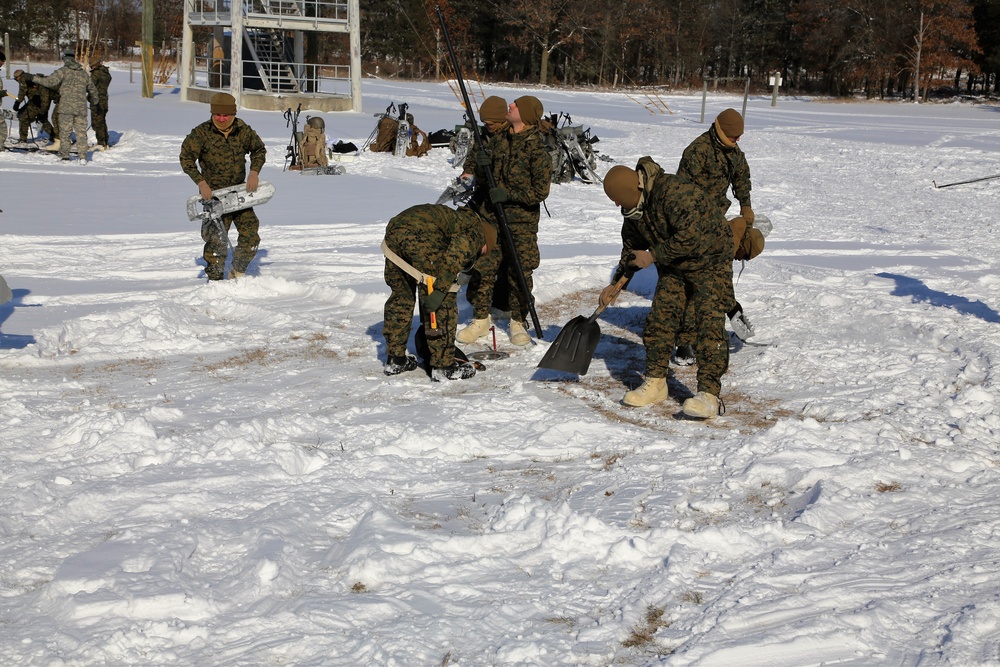 Cold-Weather Operations Course Class 18-04 students build Arctic tents during training at Fort McCoy