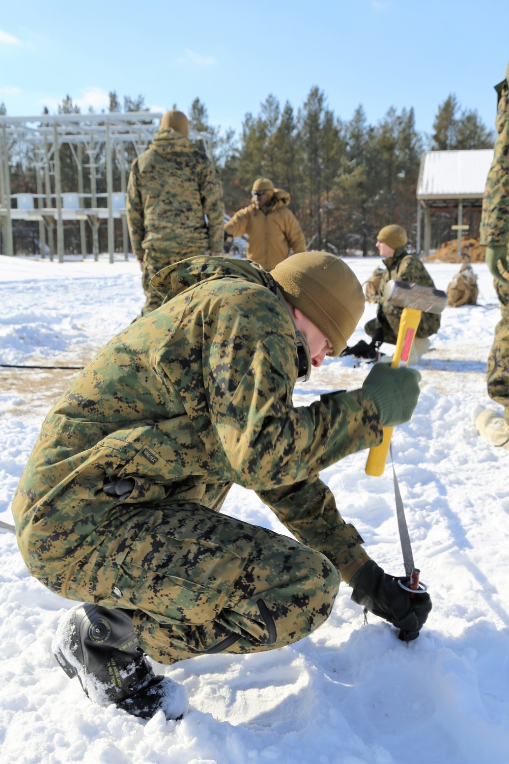 Cold-Weather Operations Course Class 18-04 students build Arctic tents during training at Fort McCoy