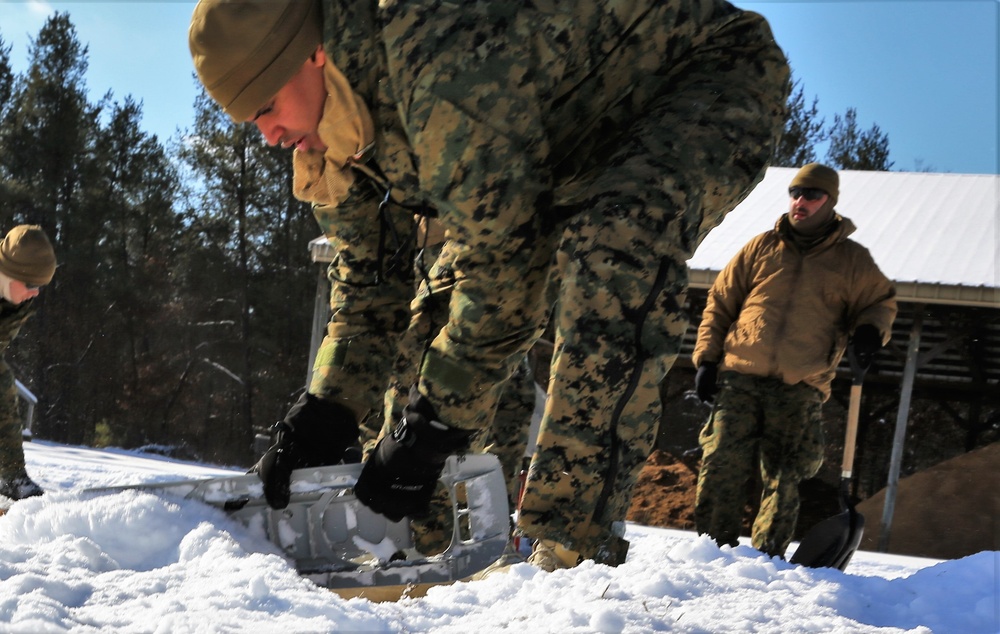 Cold-Weather Operations Course Class 18-04 students build Arctic tents during training at Fort McCoy