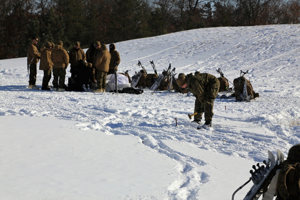 Cold-Weather Operations Course Class 18-04 students build Arctic tents during training at Fort McCoy