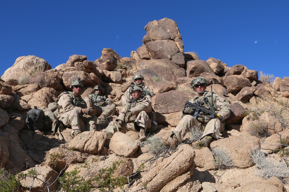 U.S. Soldiers pose for a photo at an observation post