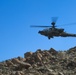 U.S. Soldiers  scout the training area for simulated enemies in an AH-64 Apache