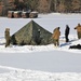 Cold-Weather Operations Course Class 18-04 students build Arctic tents during training at Fort McCoy
