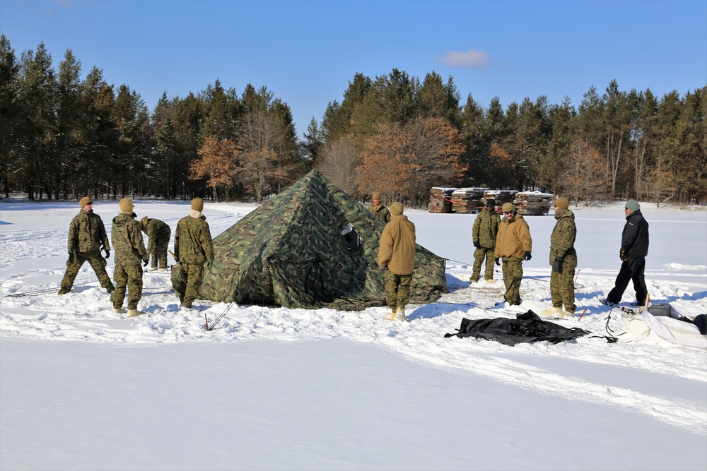 Cold-Weather Operations Course Class 18-04 students build Arctic tents during training at Fort McCoy