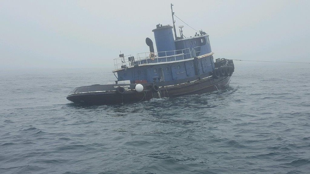 Coast Guard investigates tug collision, monitors sunken boat