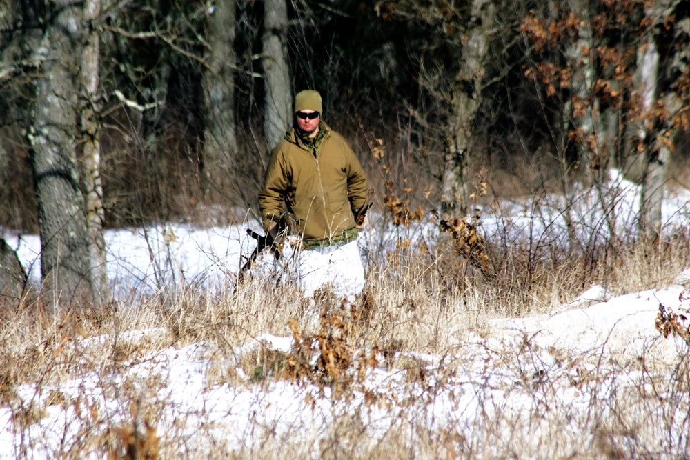 Cold-Weather Operations Course Class 18-04 students build improvised shelters during training at Fort McCoy