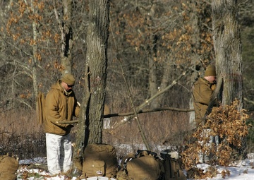 Photo Essay: Cold-Weather Operations Course Class 18-04 students build improvised shelters during training at Fort McCoy