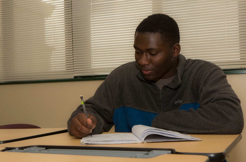 M.C. Perry student wrestles busy schedule,makes his way to top