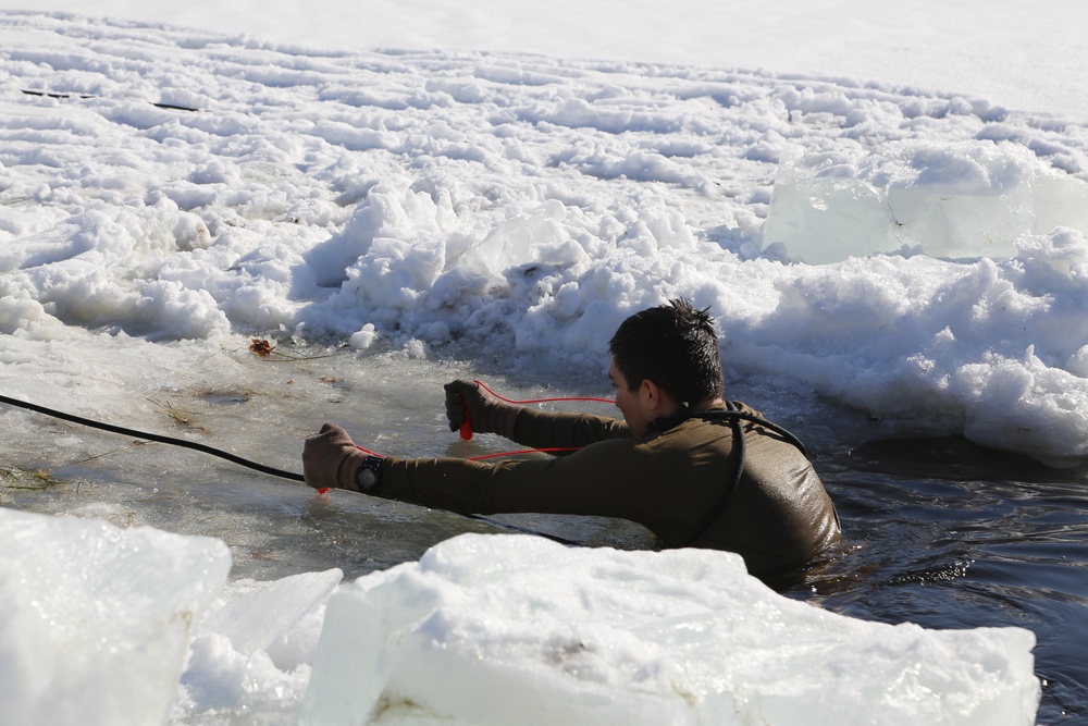 Cold-Weather Operations Course Class 18-04 students complete cold-water immersion training at Fort McCoy