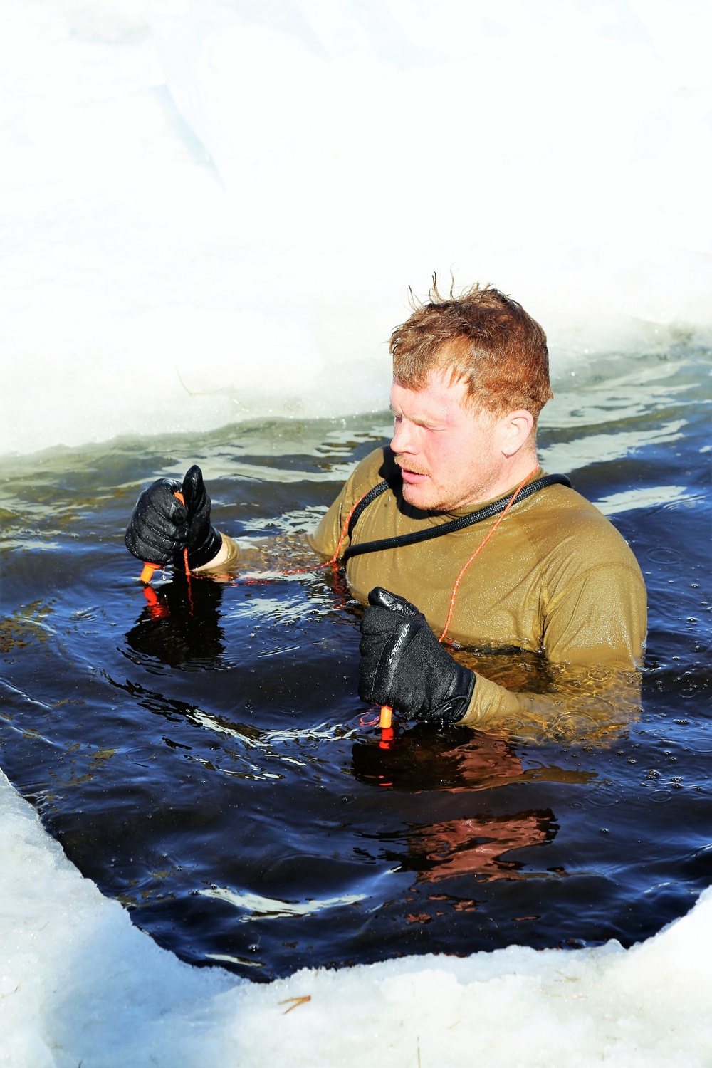 Cold-Weather Operations Course Class 18-04 students complete cold-water immersion training at Fort McCoy