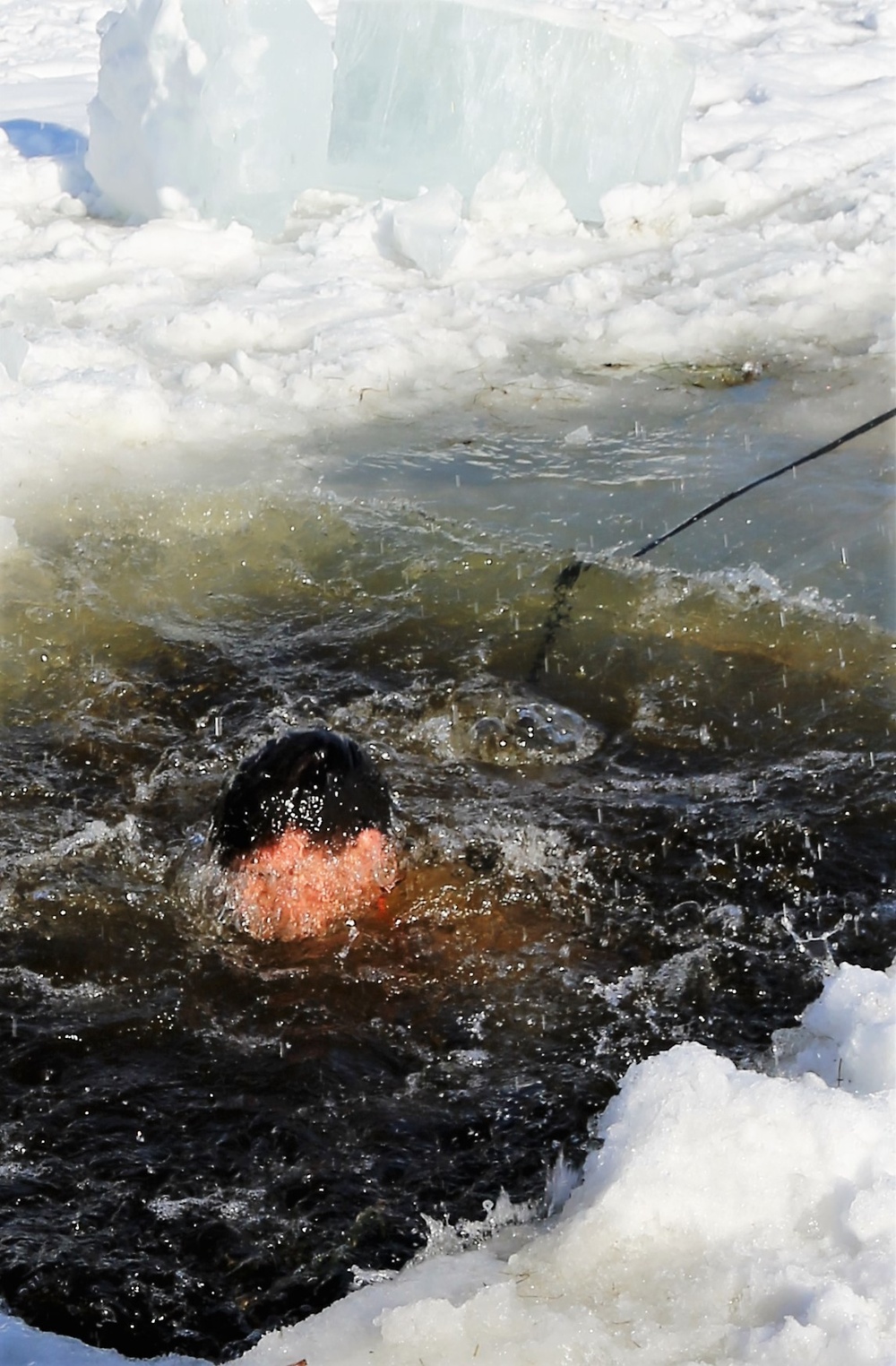 Cold-Weather Operations Course Class 18-04 students complete cold-water immersion training at Fort McCoy