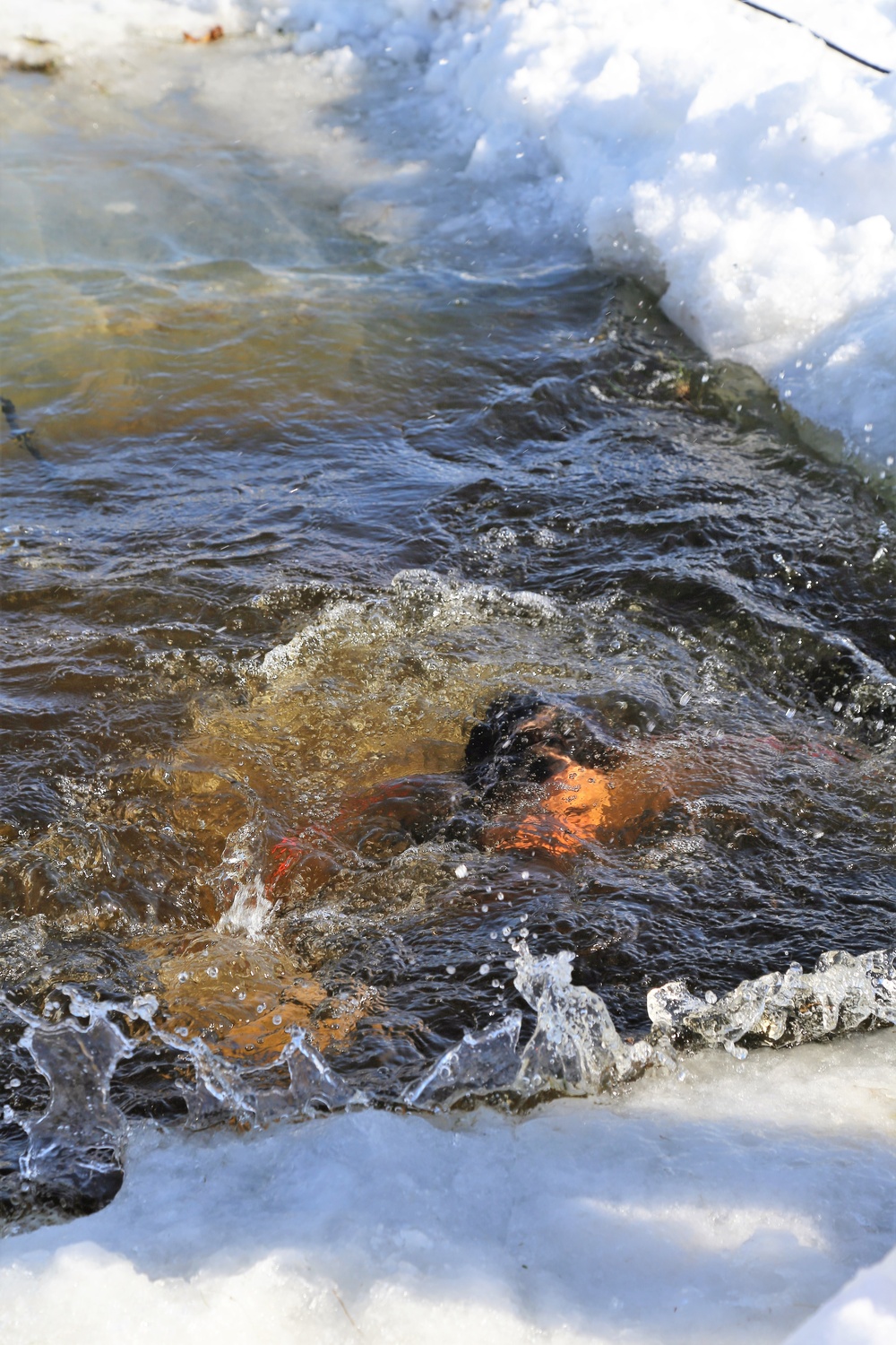 Cold-Weather Operations Course Class 18-04 students complete cold-water immersion training at Fort McCoy