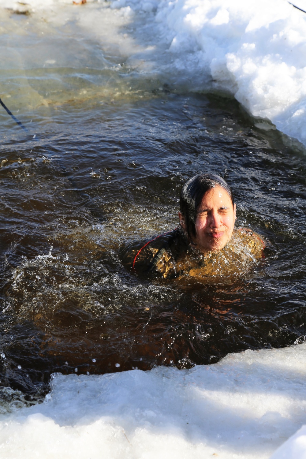 Cold-Weather Operations Course Class 18-04 students complete cold-water immersion training at Fort McCoy