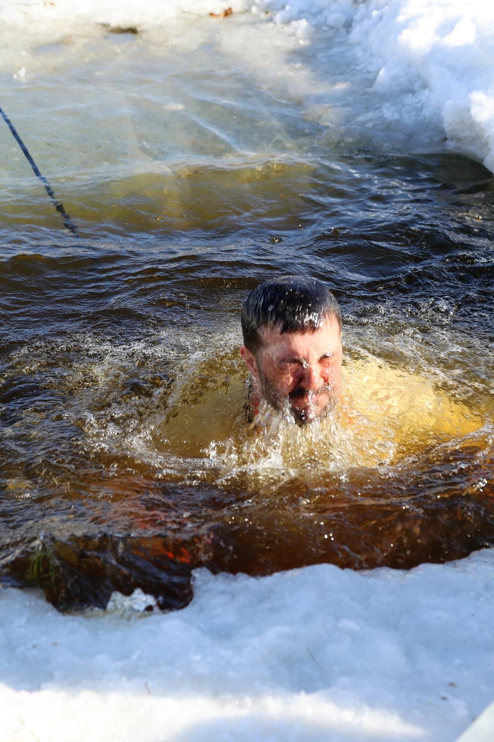 Cold-Weather Operations Course Class 18-04 students complete cold-water immersion training at Fort McCoy