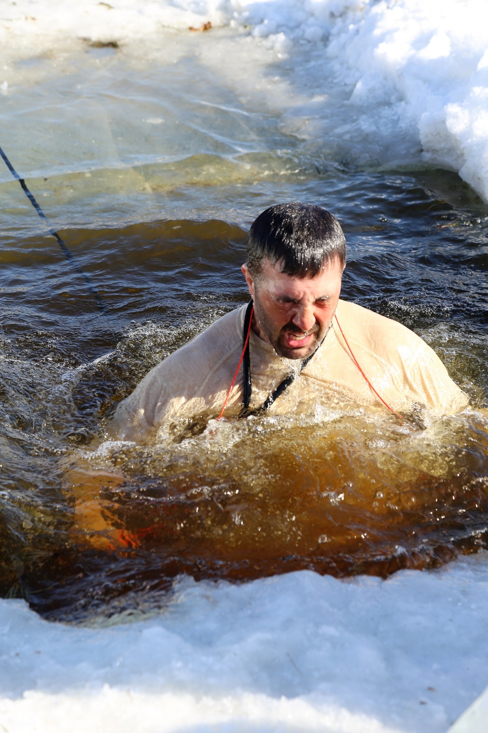 Cold-Weather Operations Course Class 18-04 students complete cold-water immersion training at Fort McCoy