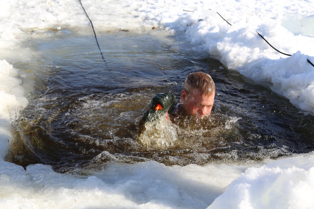 Cold-Weather Operations Course Class 18-04 students complete cold-water immersion training at Fort McCoy