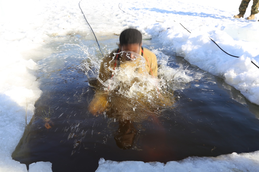 Cold-Weather Operations Course Class 18-04 students complete cold-water immersion training at Fort McCoy